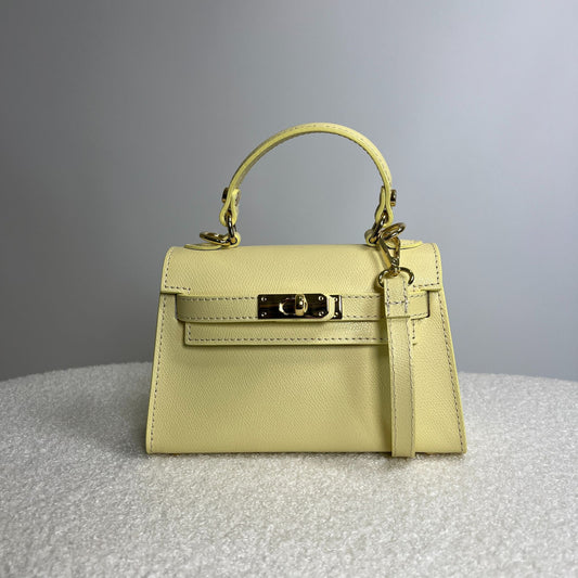 Borsa Mini kate angolata in pelle Butter Yellow con dettaglio dorato e manico rigido
